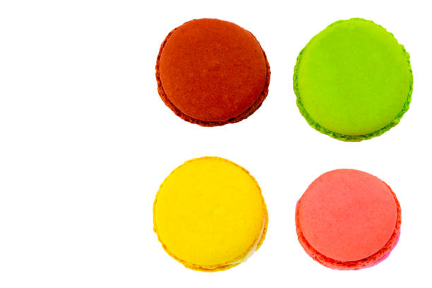 istock Macaron or macaroon on white background,. Colorful almond cookies on dessert top view 954655700