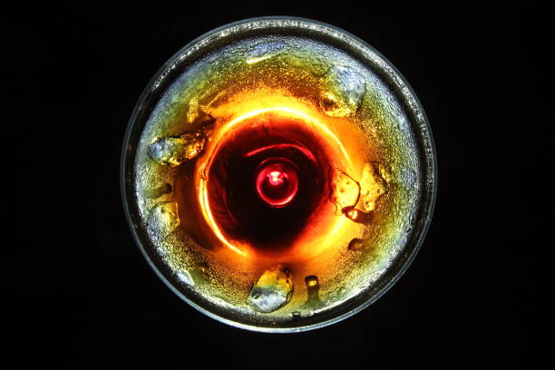 iced cold drink in a glass view from top isolated in black background