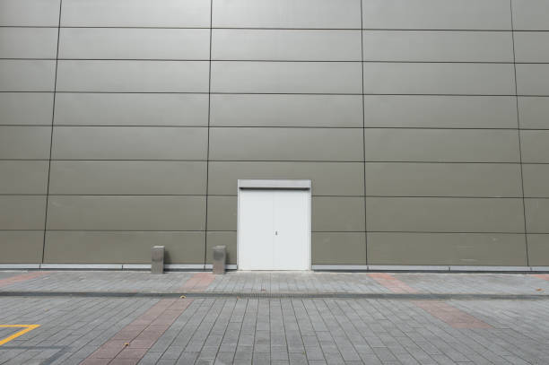 istock sidewalk by street wall & door 954661426