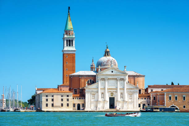 San Giorgio Maggiore church in Venice, Italy San Giorgio Maggiore church on the island of the same name, Venice, Italy. Landmark of Venice on sunny summer day. Postcard of Venice. Romantic water trip with beautiful view in Venice. san giorgio maggiore stock pictures, royalty-free photos & images