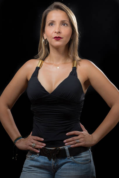 istock Latin Mid Thirties Lady Portrait Serious Looking at Camera in Studio 954662984