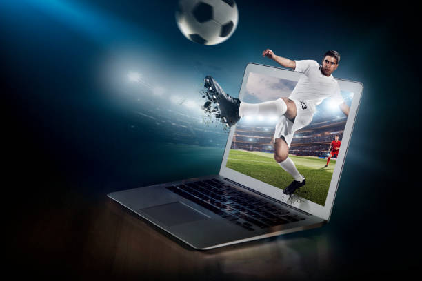 istock Soccer game on laptop. Live broadcast 954669354