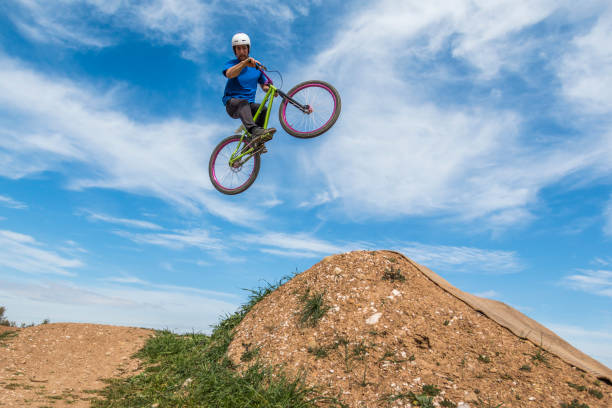 istock Young man flying on dirtjump bike 954671612