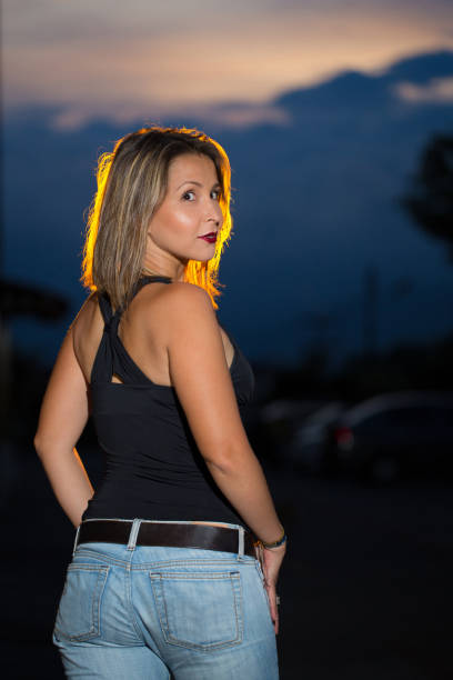 istock Latin Mid Thirties Lady Outdoors Portrait Backside Turning Head to Look at Camera 954672042