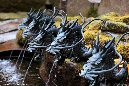 Fountain with a bronze Dragon in Hakone temple  Japan