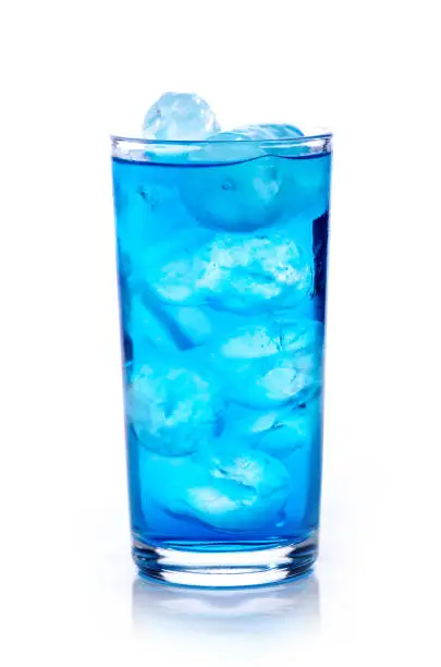 Photo of blue drink with ice cubes on white background, isolated