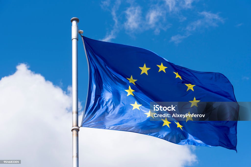 EU Flag waving against blue Sky European Union Stock Photo