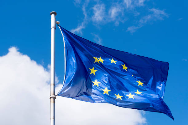 istock EU Flag waving against blue Sky 954683380