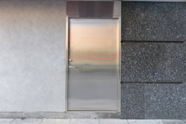 istock sidewalk by street wall & door 954686692
