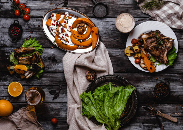 top view of delicious grilled steak with vegetables on gray wooden table