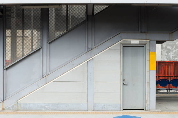 istock sidewalk by street wall & door 954688536
