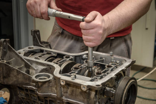 istock Repair of old car engine 954694596
