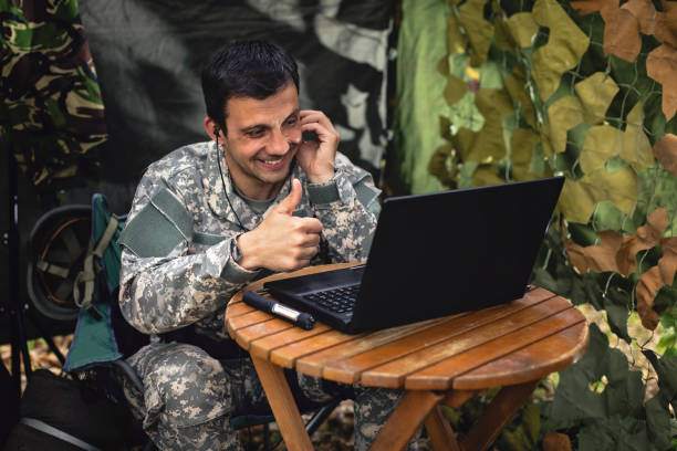 istock Soldier video chatting with his family 954696890