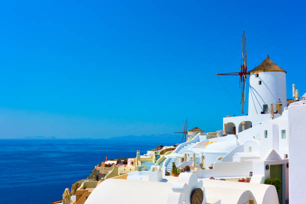 istock Houses and windmills in Santorini 954696912