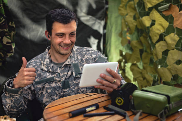 istock Army soldier with digital tablet 954697324