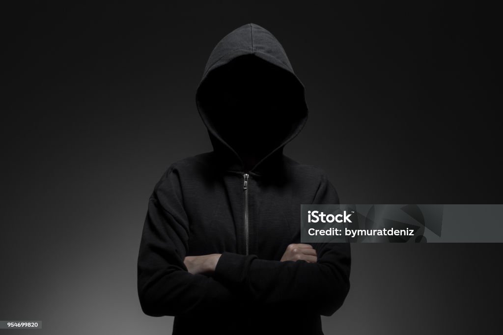 Hacker standing alone Hooded Shirt Stock Photo