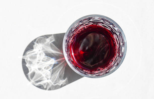 czerwone wino w szklance - directly above wineglass glass wine zdjęcia i obrazy z banku zdjęć
