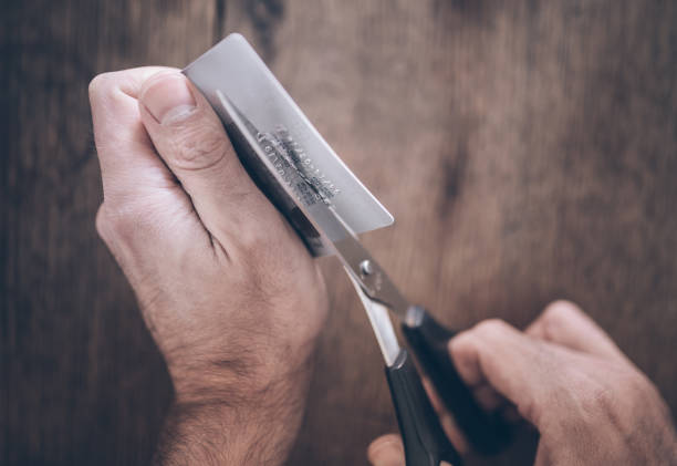 istock person cutting credit card into half with scissors 954701846