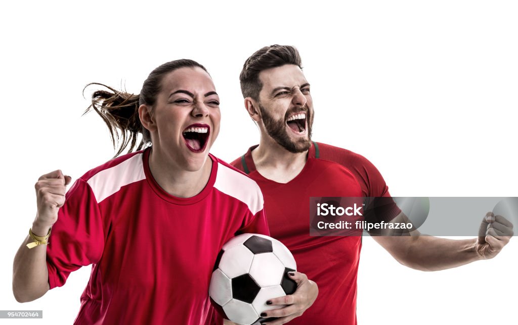 Fan de jeune couple dans la célébration de l’uniforme rouge - Photo de Fan libre de droits