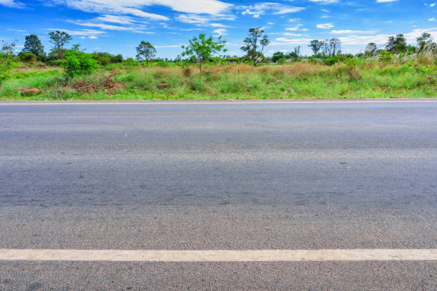 istock Asphalt road side view and landscape countryside. 954702876