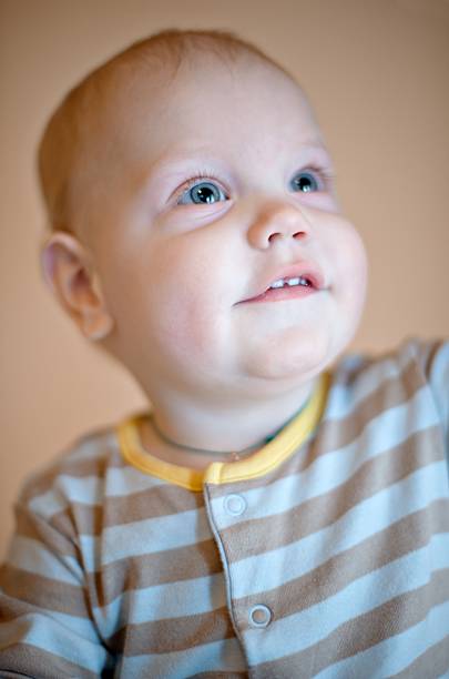 istock Amazed child looks up with a smile 95470716
