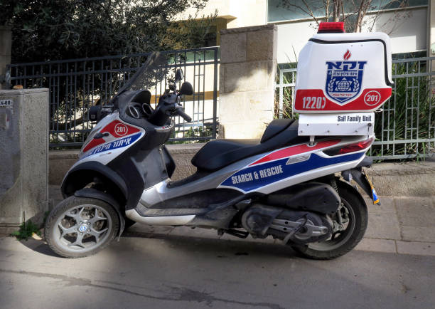 parked search and rescue motorcycle ambulance, on a sidewalk outside a hospital Jerusalem, Israel - March 6, 2018 parked search and rescue motorcycle ambulance, on a sidewalk outside a hospital, Jerusalem, Israel ambulance in israel stock pictures, royalty-free photos & images