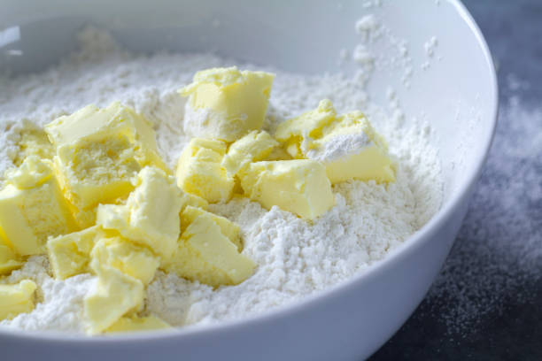 istock White mixing bowl with butter and flour 954707556
