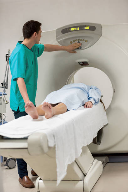 istock Young radiologist adjusting the MRI machine before starting a procedure on a patient 954708012