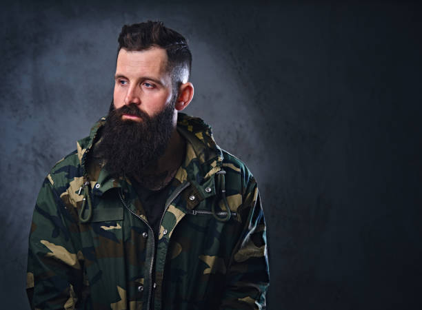 istock A man dressed in a camouflage jacket. 954711958