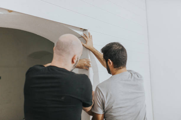 istock Rear View Of Men Attaching Wood On Wall 954713466