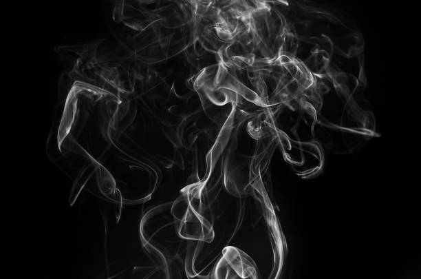 istock abstract fragment movement of white smoke on black background. 954720658
