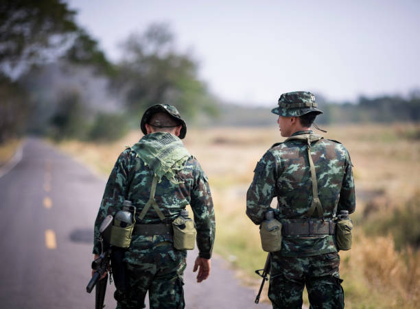 istock Asian army soldier return to base after completing military mission. 954721042