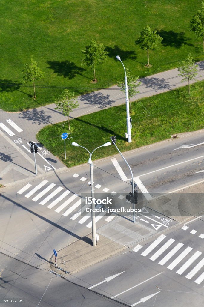 Crosswalk and bike crossing line on empty crossroad, driverless technology Aerial view of crosswalk and bike crossing line on empty crossroad, driverless technology concept Aerial View Stock Photo