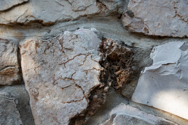istock Close up of natural stone wall. Stone wall texture 954744962