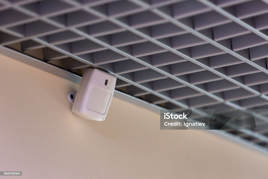 The motion sensor was triggered when the door was open, the office alarm system Sensor Stock Photo