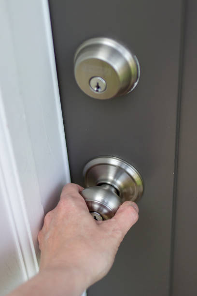 istock Woman hand on doorknob 954747390