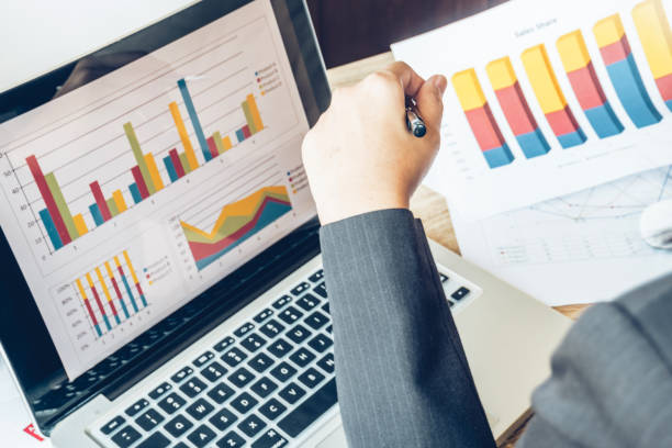 istock Business women reading document on office with tablet and graph financial diagram.Teamwork workplace strategy Concept. 954751378
