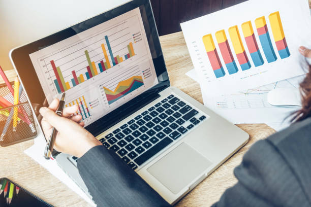 istock Business women reading document on office with tablet and graph financial diagram.Teamwork workplace strategy Concept. 954751728