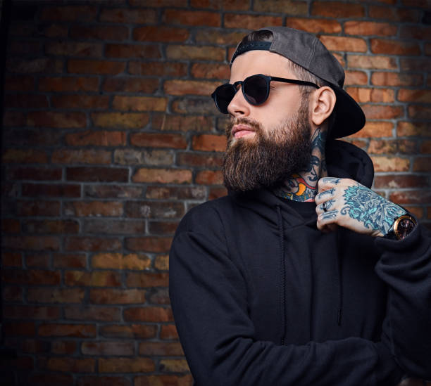 istock Tattooed bearded male in military jacket. 954756538