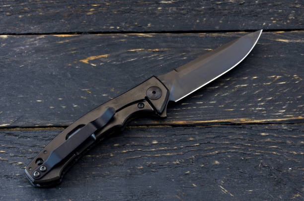 istock Knife with titanium handle. Knife with a clip. 954763064