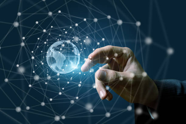 istock Hand on the background of a global network . 954764254