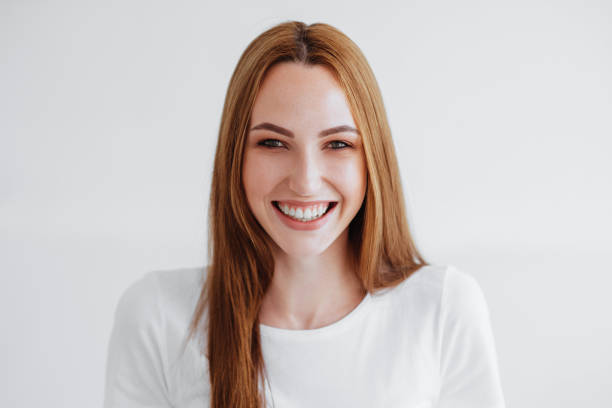 istock Girl smiles on white 954764982