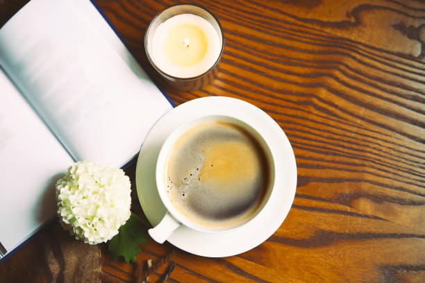 istock Coffee, book, plaid and candle at home 954765316