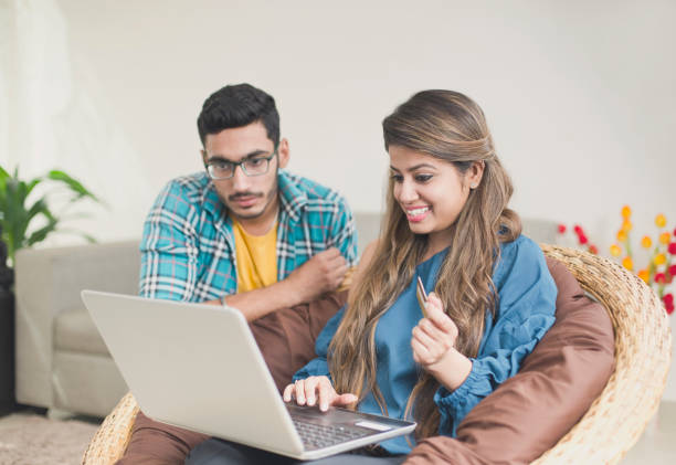 istock Happy couple shopping online 954768316