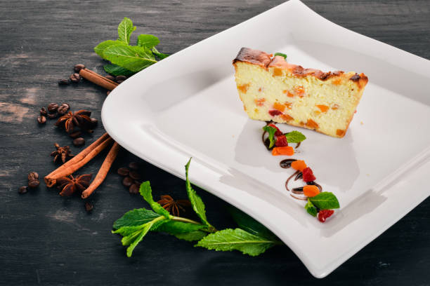 istock Cheese pudding with fruit. On a wooden background. Top view. Copy space. 954768468