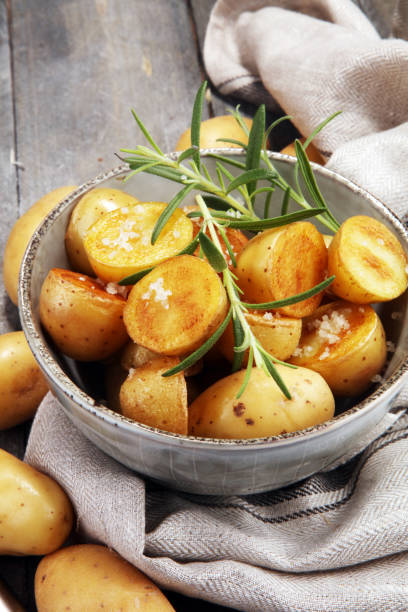 istock Roasted potato with fresh rosemary in a bowl 954769980
