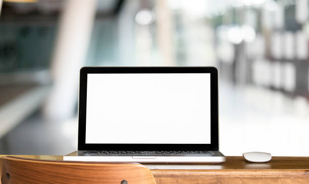 istock Mockup laptop computer with workplace and modern office blur background. 954770732