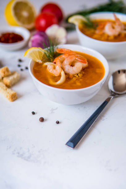 istock Lentil soup with seafood. Red soup with shrimps and squid 954773610