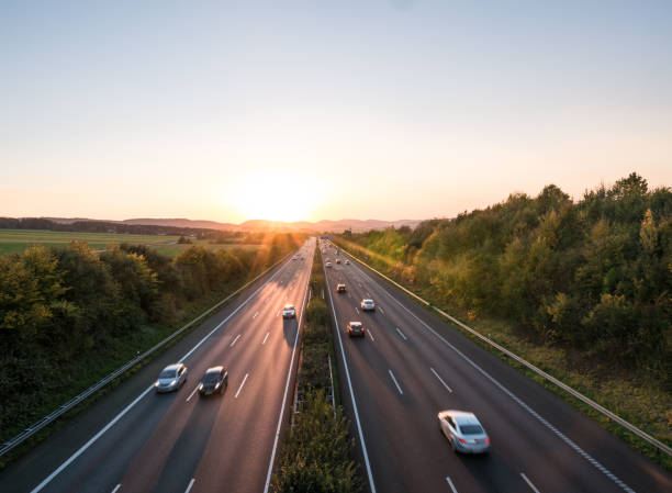 istock The road traffic on a motorway at sunset 954774350