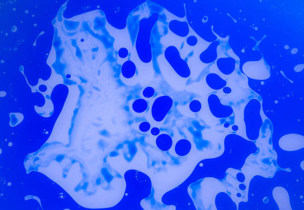 istock The abstract background with paints on a glass 954777716